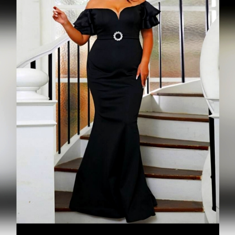 Black Mermaid styled formal gown with belted waist.